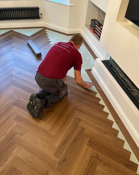 Ivan, head LVT installer at Carpet Style, fitting Karndean Art Select herringbone parquet flooring