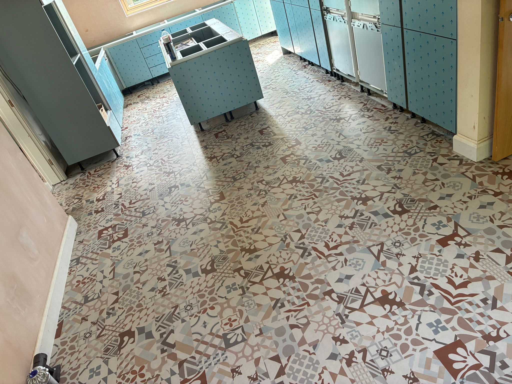 Karndean Marrakesh SP220 patchwork LVT floor fitted in a family kitchen